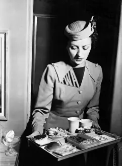 Trans Prints: TWA air stewardess with an in-flight meal