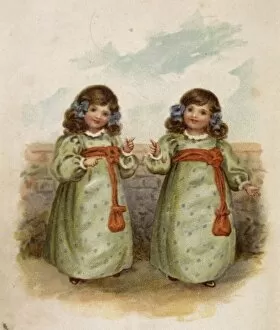Twin girls in identical dresses