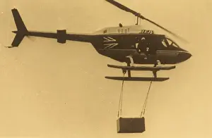 Various helicopters lifting load
