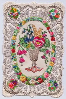 Vase of flowers on a paper lace greetings card