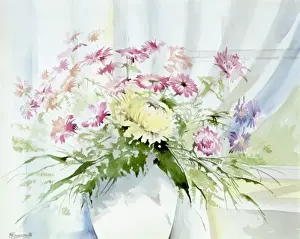 Vase of flowers on window ledge