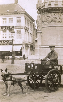 Images Dated 15th May 2017: Vendor with dog cart, Market Square, Bruges, Belgium