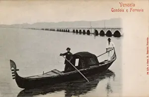 Venice, Italy - Covered gondola and the Railway Bridge