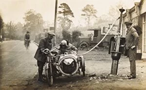 Garage Gallery: Veteran 1910 motorcycle & sidecar refuelling at a garage