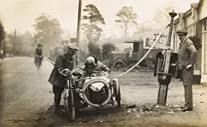 Petrol Prints: Veteran 1910 motorcycle & sidecar refuelling at a garage