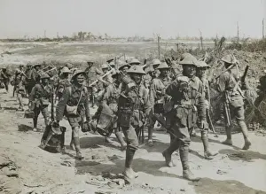 Heading Prints: Vickers machine-gun team marching past a working party