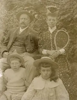 Victorian family group with tennis racquet