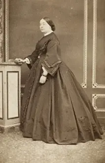 Victorian woman in a dark crinoline dress