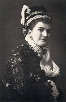 Victorian woman in frilly costume and hat