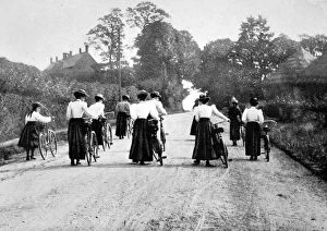 Cyclists Collection: Victorian Women Cyclists Pushing their Bicycles, c. 1898