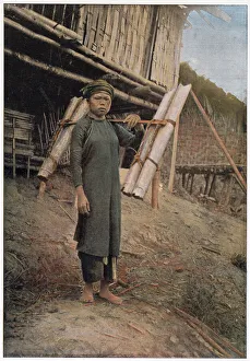 Images Dated 6th April 2021: This Vietnamese peasant is carrying water in bamboo pipes. Date: 1890s