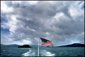 New Images November Prints: View of Alcatraz from ferry - American Flag, San Francisco