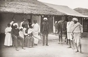 Vintage 19th century photograph: captioned Group of Coolies family of Indian workers