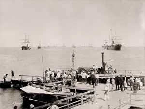 Vintage 19th century photograph: pier at Ismailia, steam launch and ships in the harbour Vintage 19th century photograph: pier at Ismailia, steam launch and ships in the harbour