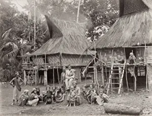Vintage 19th century photograph: Singapore, native family group outside their house Vintage 19th century photograph: Singapore, native family group outside their house