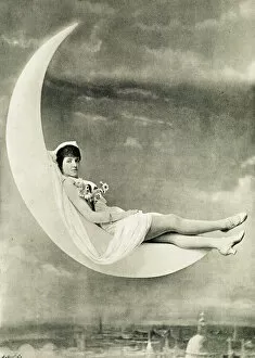 Violet Friend, reclining on a crescent moon