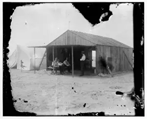 Visitors and fellow campers in the Wrights work shed at Kit