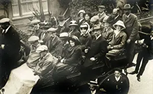 Solid Prints: Visitors / Holidaymakers (wrapped-up warm!) head off on a British sightseeing tour in a