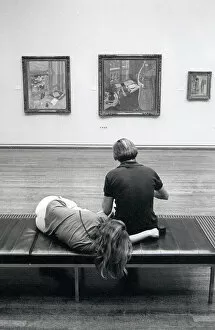 Visitors resting in The Tate Gallery, London