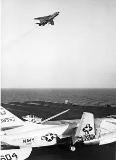 A Vought F-8 Crusader approaches the USS Independence