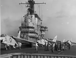 Three Vought F8U Crusaders from VX-3 taxi