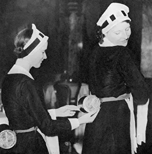 Waitresses wearing gas masks, WWII