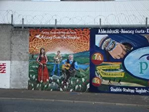 Images Dated 27th July 2011: Wall mural of Tommy Sands with Moya & Fionan at Belfast