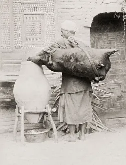 Water carrier with an animal skin container, Egypt