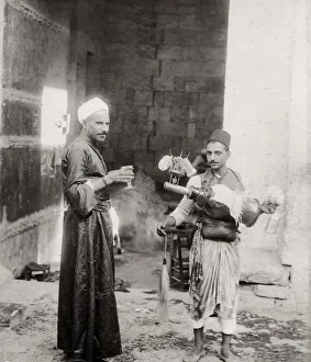 Water carrier or drink vendor and customer, Cairo, Egypt
