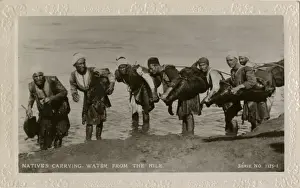 Water carriers with water from the Nile, Egypt