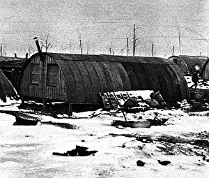 Weatherproof winter field-barracks: snowy Nissen huts, 1917