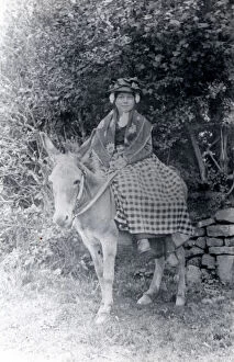 Welsh woman in traditional costume on a donkey