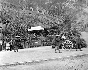 Inequality Prints: Western woman in carrying chair, Hong Kong, China