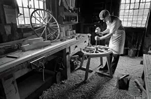 Carpenter Collection: Wheelwright makinbg wooden wheels, Blists Hill, Ironbridge
