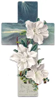 White flowers on a cross-shaped greetings card