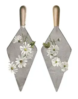 White flowers on trowels on two cutout greetings cards