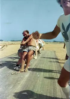 Oman Prints: White men pulling rope in Oman