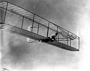 Wilbur Wright in the 1902 glider in flight