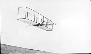 Wilbur Prints: Wilbur Wright in the 1902 glider in flight