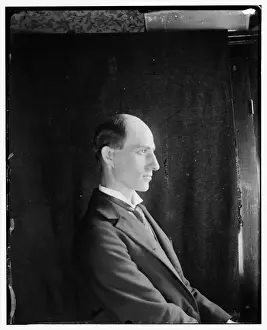 Wilbur Wright, age 30, seated facing right, half-length side