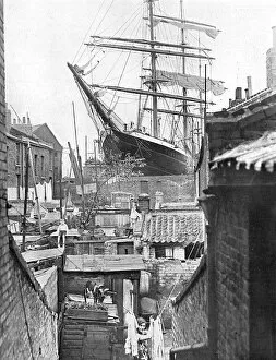 Dock Collection: A windjammer looming over a London street
