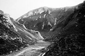 Peak Collection: Winnats Pass in the Peak District showing snow poles