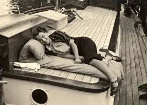 Snooze Prints: Woman asleep on board boat