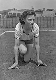 Woman athlete in starting position