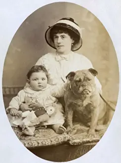 Woman with baby and dog in studio photo