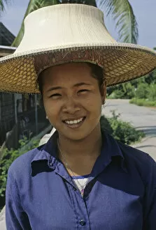 Thailand Gallery: Woman in Bangkok wearing traditional Thai hat, or ngob
