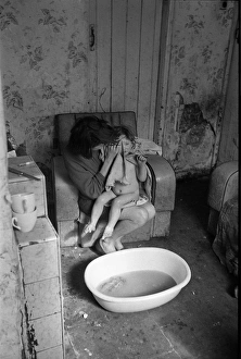 Woman bathing baby, Falls Road, Northern Ireland