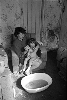 Woman bathing baby, Falls Road, Northern Ireland