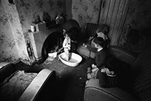 Woman bathing baby, Falls Road, Northern Ireland