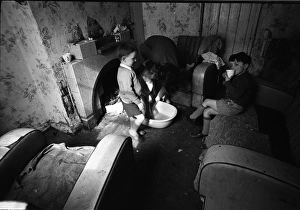 Woman bathing baby, Falls Road, Northern Ireland